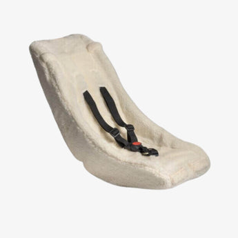 Beige car seat cover with black straps on a white background