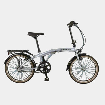 Silver folding bicycle on a light blue background