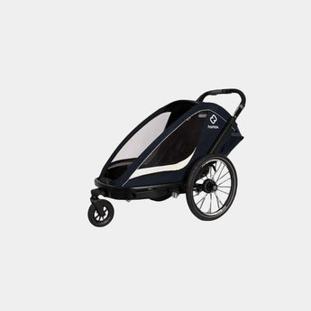 Black and white baby stroller on a gray background