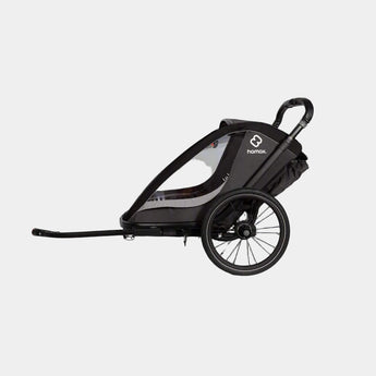 Black child bike trailer with a visible brand logo on a gray background