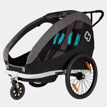 Black and gray bike trailer with teal accents on a light gray background