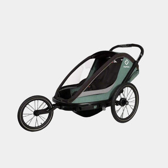 Child stroller with a green and black design on a gray background