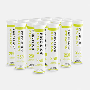 A group of white Precision Hydration 250 electrolyte supplement tubes arranged on a light gray background.