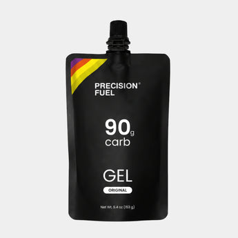 A black Precision Fuel 90g carb gel pouch with a black cap, featuring white text and a small yellow, orange, and purple accent stripe on the top left, set against a light gray background.