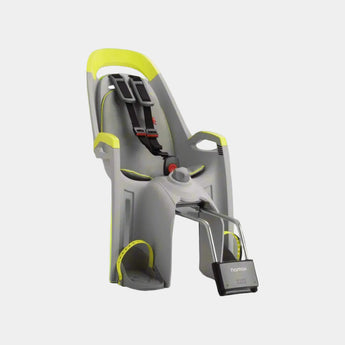 A Hamax Amaze Child Bike Seat with lockable bracket, featuring a gray seat with yellow accents, mounted on a bike.