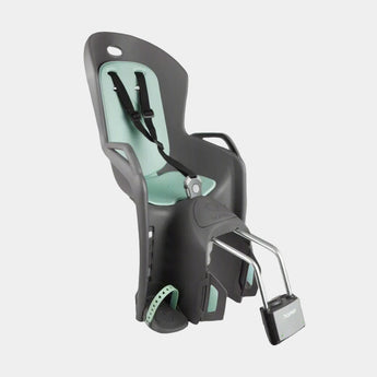 A Hamax Amiga child bike seat in black with green accents, featuring a shock-absorbing dual-bar steel suspension system, a 3-point harness, and wheel guard attachments.