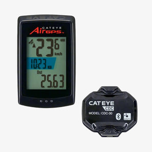 Cateye Air GPS Cycle Computer and Cadence Sensor. The computer has a black display showing speed and distance metrics, and it is paired with a black cadence sensor.