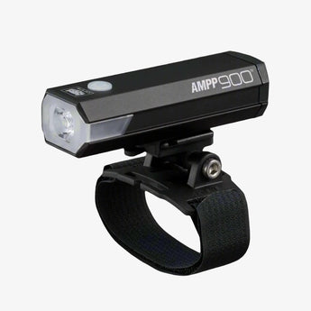 Cateye AMPP 900 bike helmet light mounted on a black strap, with a sleek black body featuring LED lights and control buttons.