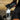 Person pouring a powder from a black 'SIS' container into a white bottle.