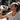 Person drinking from a SIS (Science in Sport) water bottle outdoors.