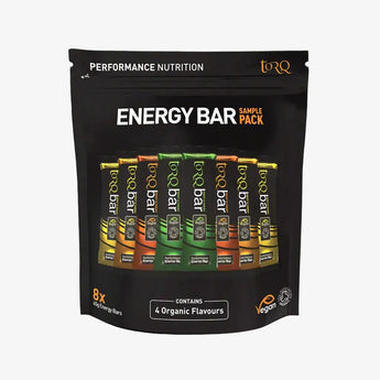 Pack of Torq energy bars with various flavors on a black background