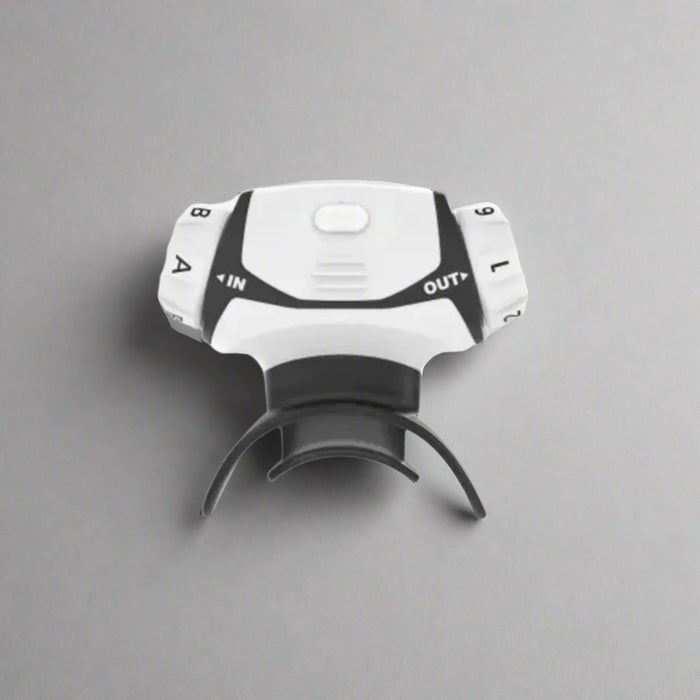 White and black bike light with 'IN' and 'OUT' labels on a white background