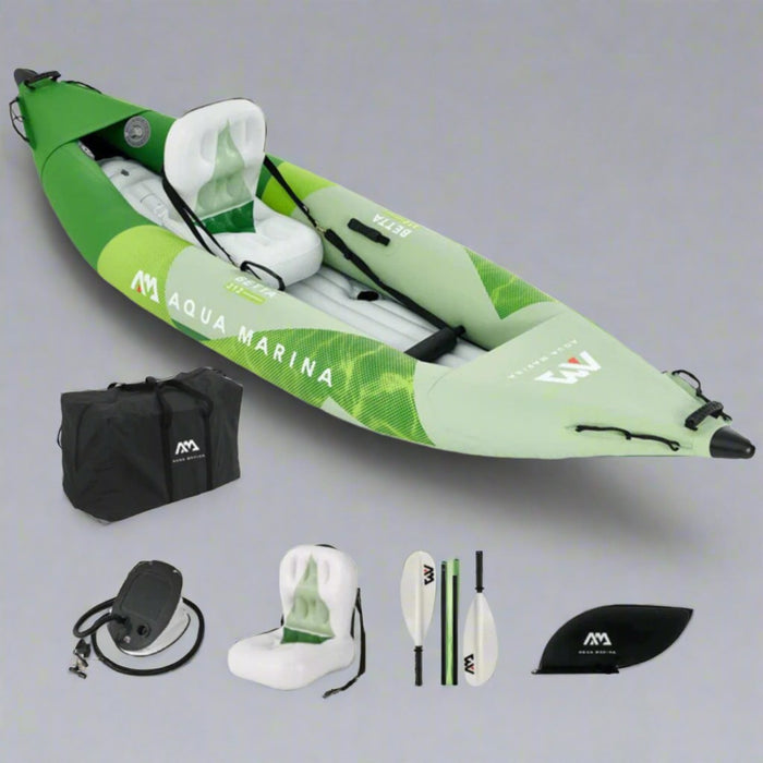 Inflatable kayak with accessories on a gray background, featuring Aqua Marina branding.