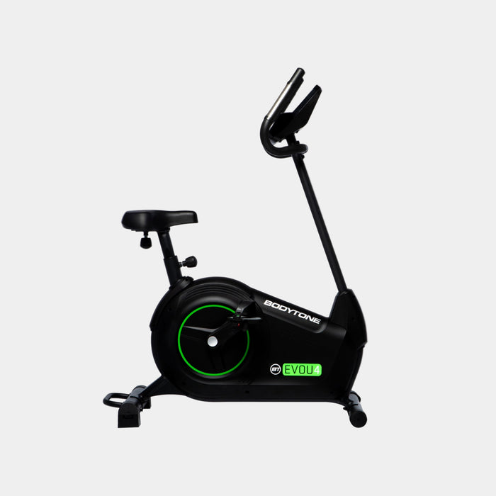Black exercise bike with green details on a white background