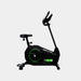 Black exercise bike with green details on a white background