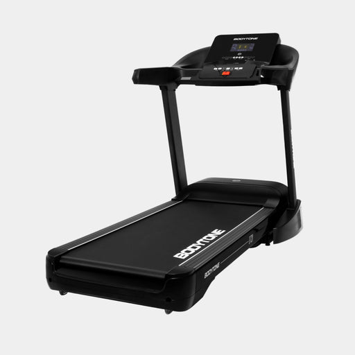 Black treadmill with digital display on a white background