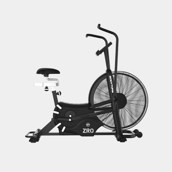 Black exercise bike with fan on a white background