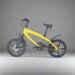 Yellow bicycle with black components on a white background