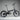 Black folding bicycle on a grey background