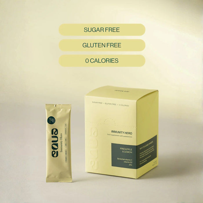 Yellow package and sachet of Immunity Hero drink mix on a beige background