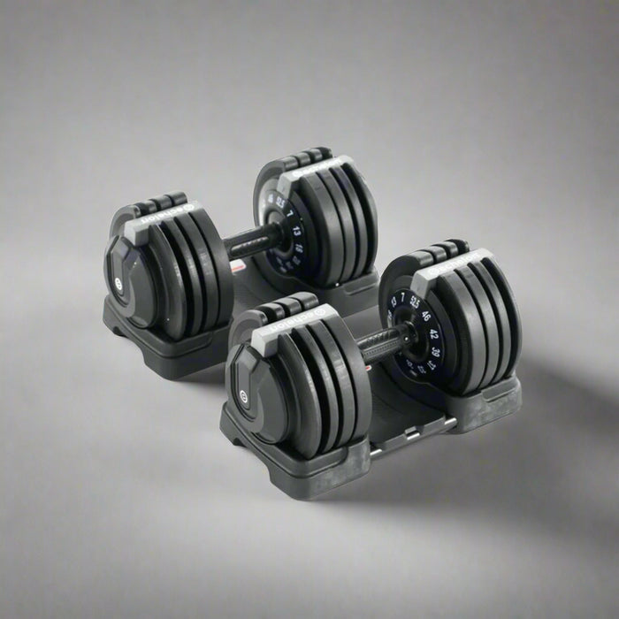 Pair of adjustable dumbbells on a white background