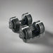 Pair of adjustable dumbbells on a white background