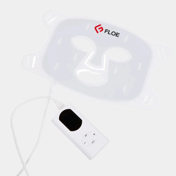 White face mask with control panel on a white background, featuring the 'Floe' brand.