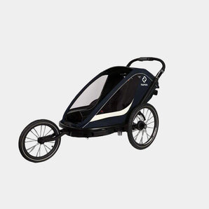 Black and white stroller with 'hamax' branding on a gray background