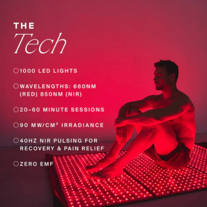 Person sitting on a red LED mat with technical specifications listed on a pink background