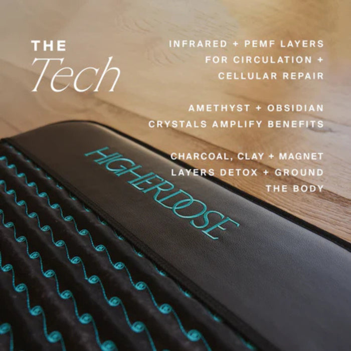 Infrared PEMF mat with text detailing its features on a wooden surface