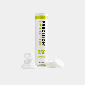A white cylindrical Precision Hydration 250 electrolyte rehydration tablet tube with lime green and black text, shown with its white cap and mesh filter insert on a light gray background.