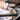 Person holding a bike handlebar with a 'Precision Fuel & Hydration' sticker.