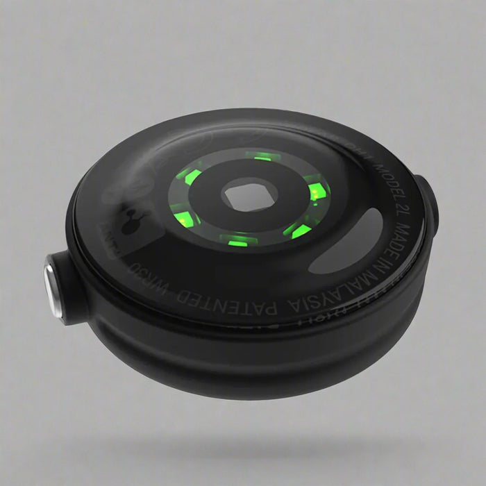 Black camera lens with green accents on a light gray background