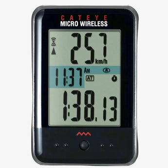 Cateye Micro Wireless Cycle Computer displaying speed and distance information on its digital screen, mounted on a black surface.
