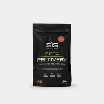 A black stand-up pouch of SIS Beta Recovery drink mix on a light gray background. The packaging features white text and a small red circular badge indicating chocolate malt flavor.