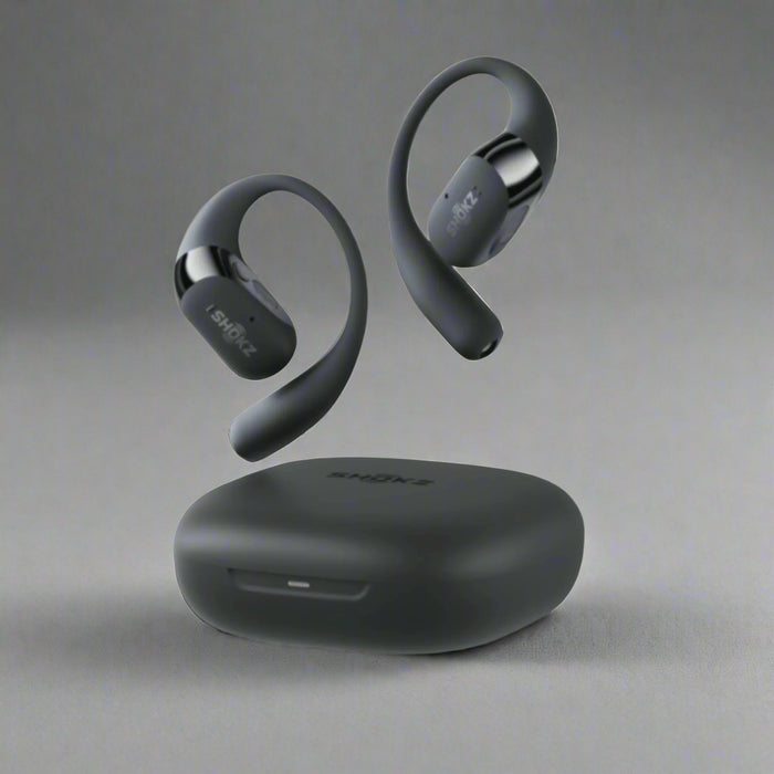 Black wireless earbuds with charging case on a white background