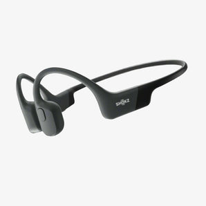 Shokz OpenRun Mini Earphones in black color, featuring a behind-the-neck design with in-ear headphones.
