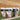 Three packages of SIS Rego Rapid Recovery on grass with a sports field background