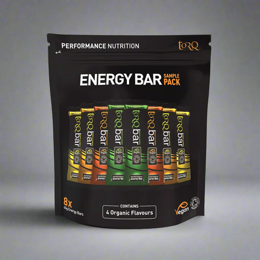 Pack of Torq energy bars with various flavors on a black background