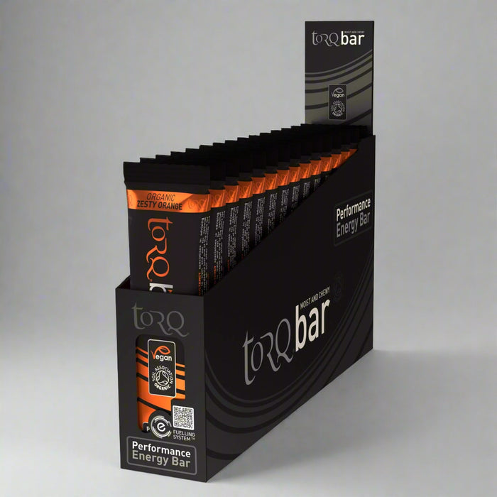 Display of torQ bar performance energy bars in a black packaging box.